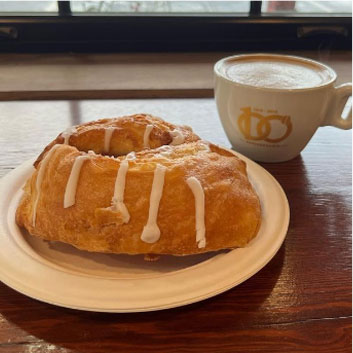 specialty coffee served with a danish