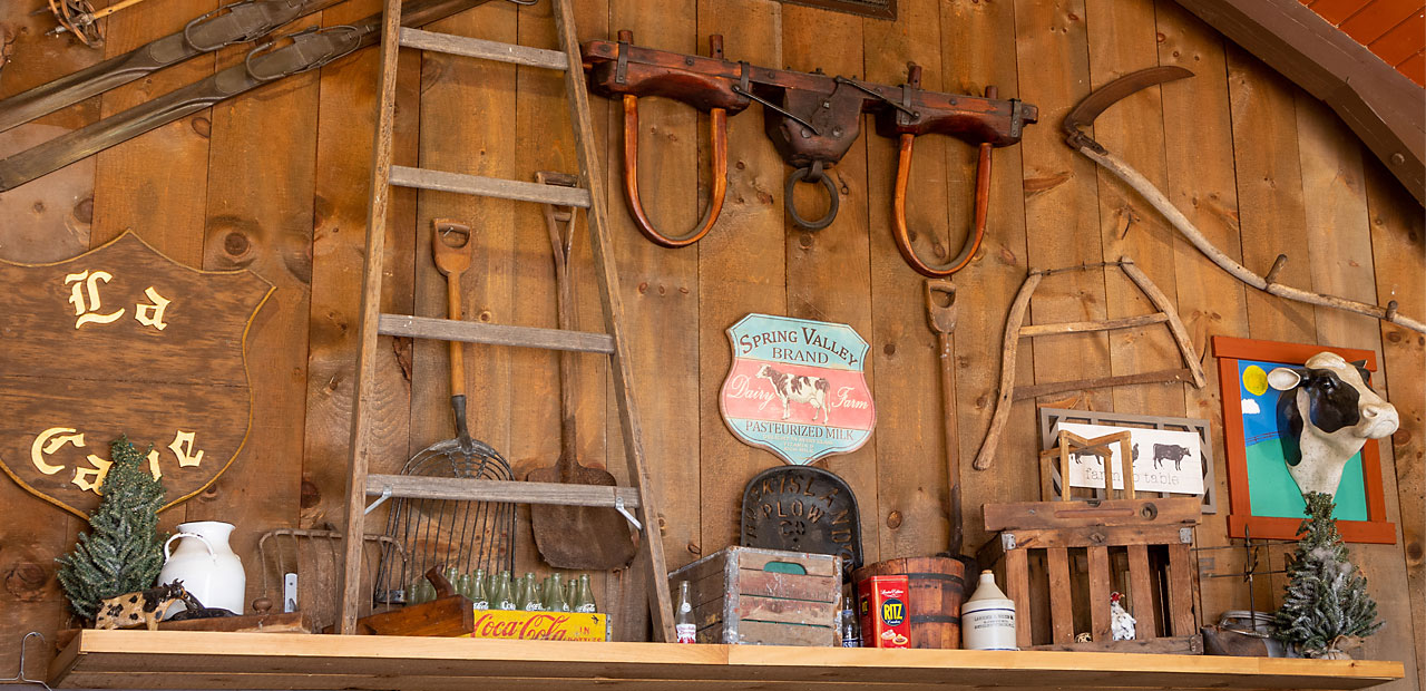 A collection of antique rustic items inside the beef Barn
