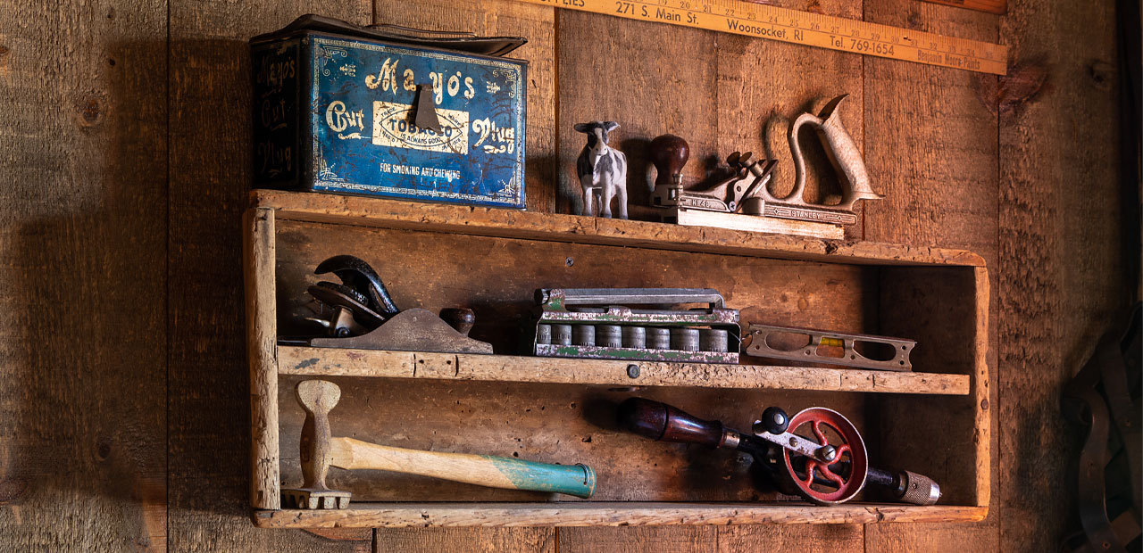 Antique tools on shelves inside the Tool Shed dining room